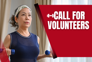 Call for volunteers. Woman doing bicep curls with light weights wearing a blue tank top and headband.